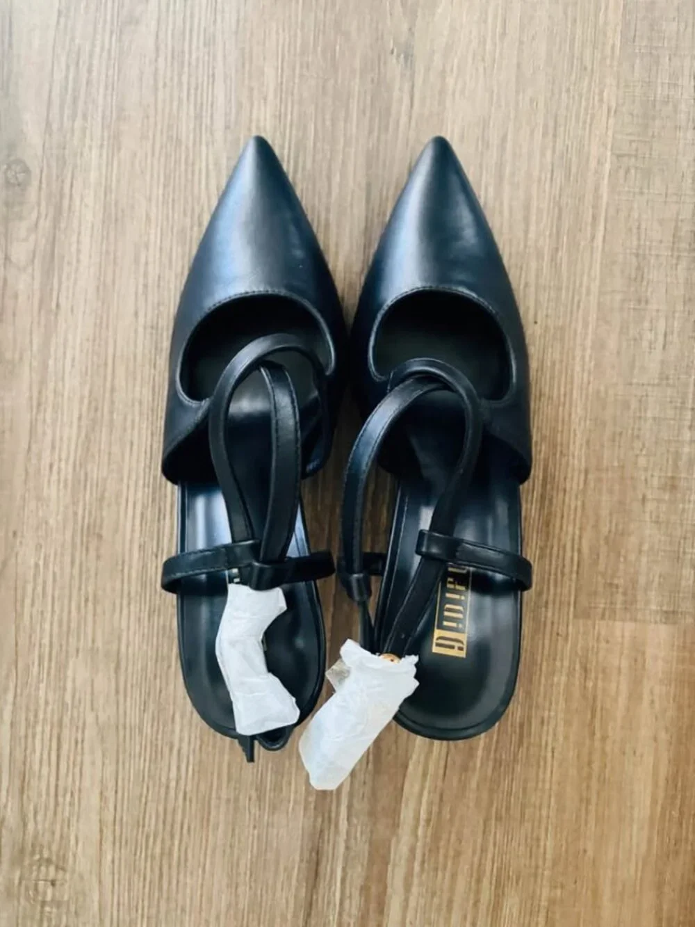 black slingback pointed-toe flats from